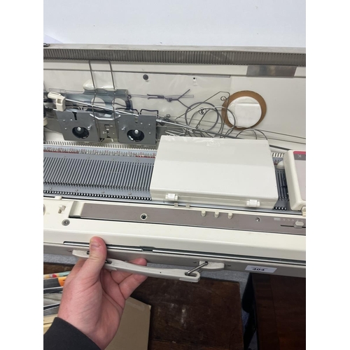 404 - Brother KH891 knitting machine in case with accessories and instructuions