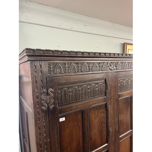 419 - Carved oak wardrobe - Approx size W: 140cm D: 62cm H: 183cm