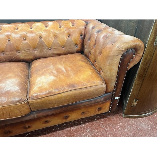 446 - Distressed tan leather 2 seater Chesterfield 