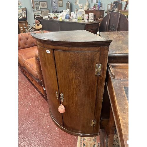 447 - Antique bow front corner cupboard