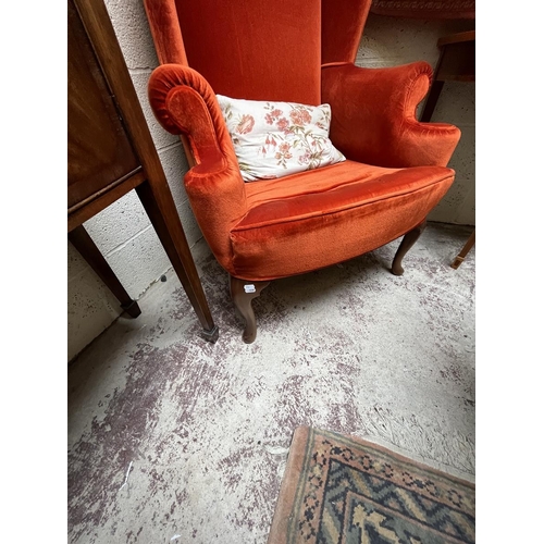 474 - Vintage Christie Tyler orange fabric Queen Anne style wing chair (labelled underneath)