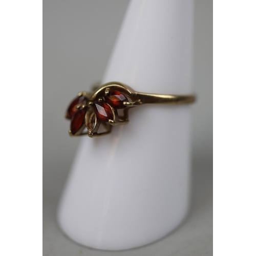 61 - 9ct gold stone set garnet ring with 1 missing stone - Size N