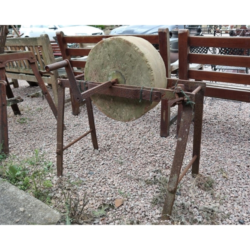 192 - Antique Cotswold limestone sharpening wheel on stand