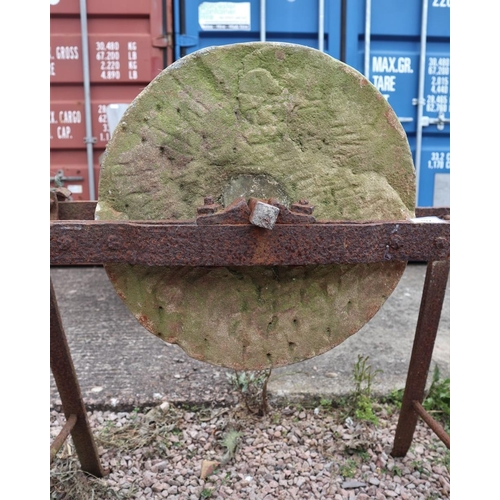 192 - Antique Cotswold limestone sharpening wheel on stand