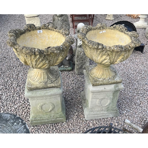 231 - Pair of garden urns on plinths - Approx height: 84cm