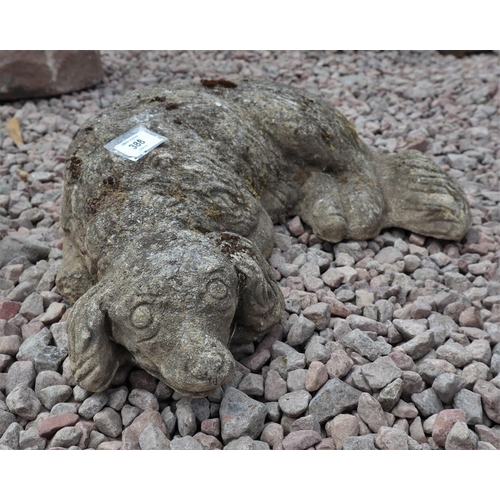 388 - 2 stone garden ornaments - otter & dog