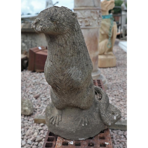 388 - 2 stone garden ornaments - otter & dog