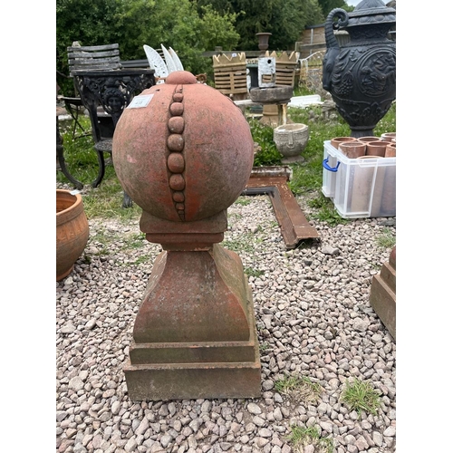 435 - Pair of terracotta orb finials - Approx height: 70cm Base 30 x 30cm approx