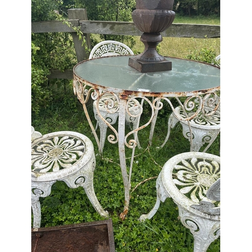 467 - Glass top metal bistro table with 4 matching chairs 