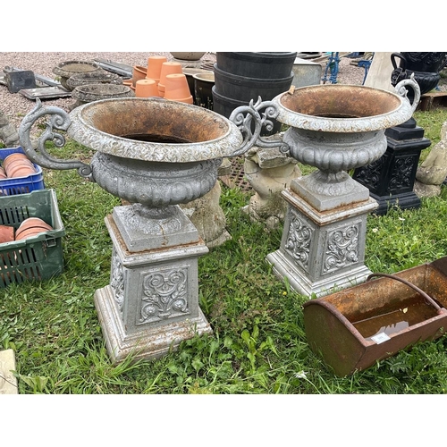 607 - Pair of cast iron pedestal planters on plinths - Approx height: 80cm