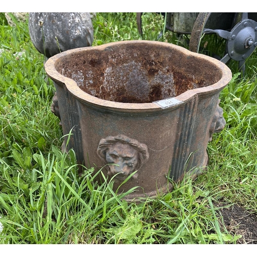 621 - Cast iron planter adorned with lions 