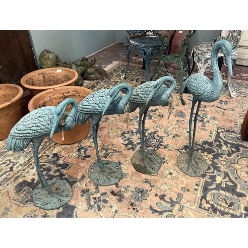 87 - 4 metal crane figures with verdigris patina - Approx height of tallest: 77cm