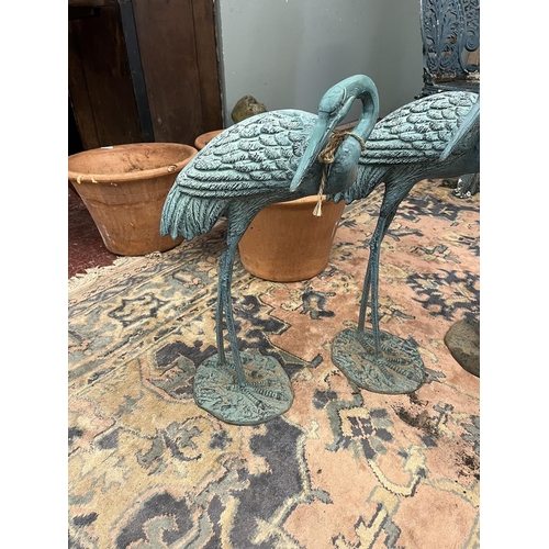 87 - 4 metal crane figures with verdigris patina - Approx height of tallest: 77cm