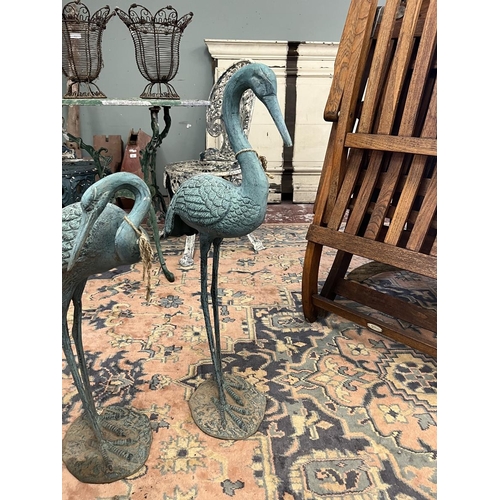 87 - 4 metal crane figures with verdigris patina - Approx height of tallest: 77cm