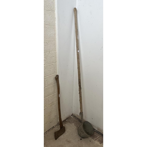 98 - Large vintage long handled ladle together with a long handled felling axe