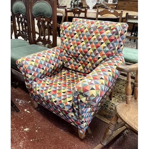 561 - Antique armchair upholstered in colourful, geometric fabric