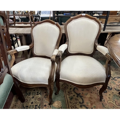 565 - His and hers upholstered armchairs