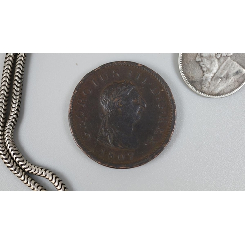 142 - Kruger silver shilling on chain together with 2 George III pennies