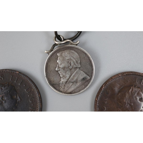 142 - Kruger silver shilling on chain together with 2 George III pennies