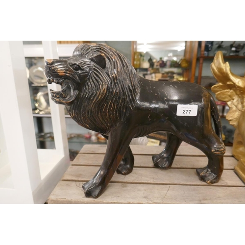 277 - Large carved wooden lion - L: 36cm H: 27cm approx