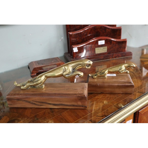 425 - 2 brass Jaguar car mascots mounted on timber