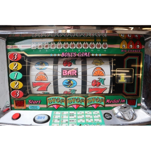 523 - Pulsar gaming machine with tokens (lights up but not operational)