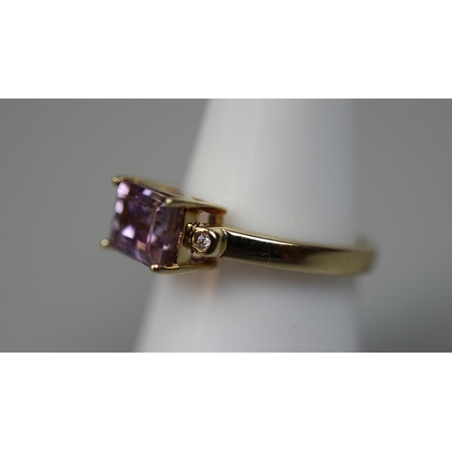 63 - 9ct amethyst and diamond set ring - Size N