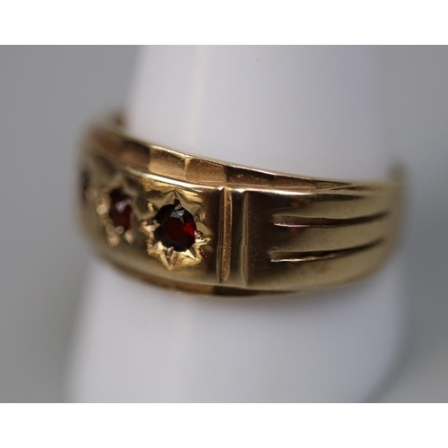 82 - 9ct gold 3 stone garnet set ring - Approx weight 6.4g - Size V