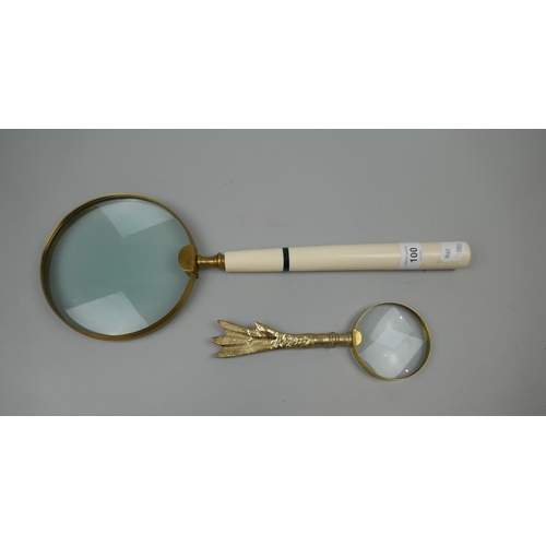 100 - Large magnifying glass together with another