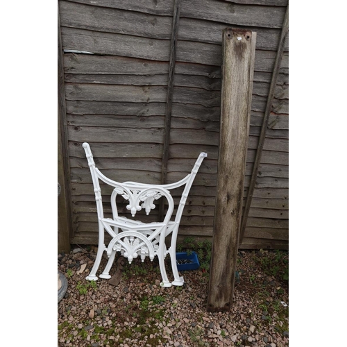 376 - 2 cast iron bench ends together with wooden slats ready for assembly