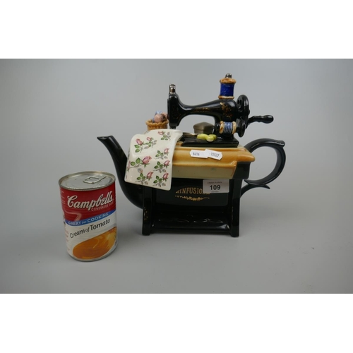 109 - Novelty ceramic teapot of a sweing machine marked Infusion