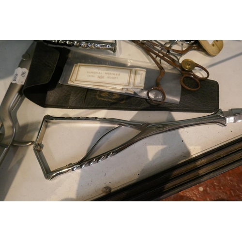 127 - Collection of surgical medical instruments to include W&H Hutchison curved needle set