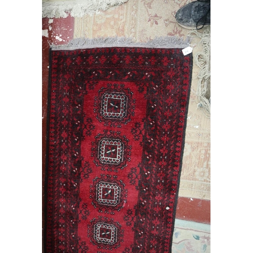 214 - Red patterned runner - Approx size: 292cm x 77cm