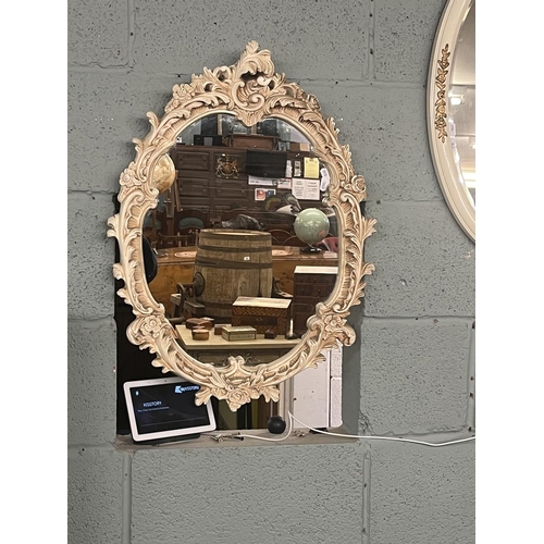 231 - 2 ornate oval mirrors