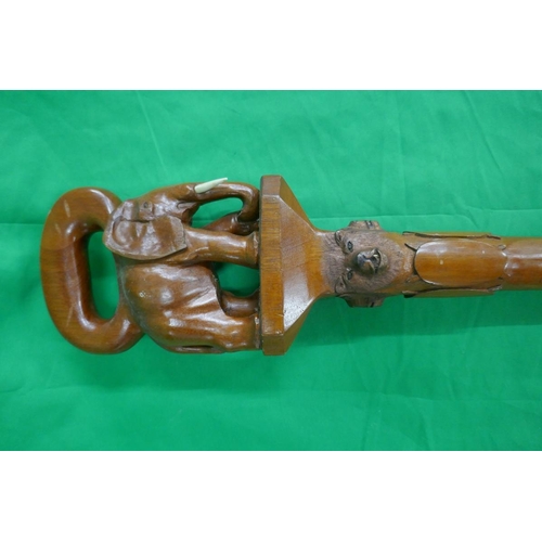 275 - Unusual carved walking stick adorned with elephant and lions