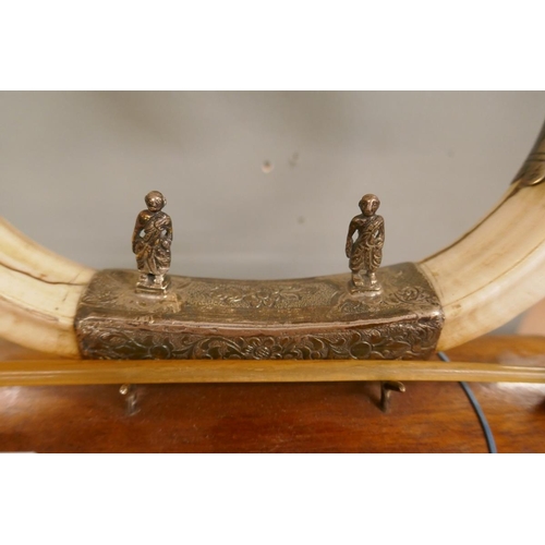 284 - Boar tusk and white metal table gong