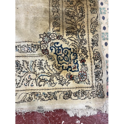 293 - Cream & blue patterned antique rug - Approx size: 275cm x 158cm