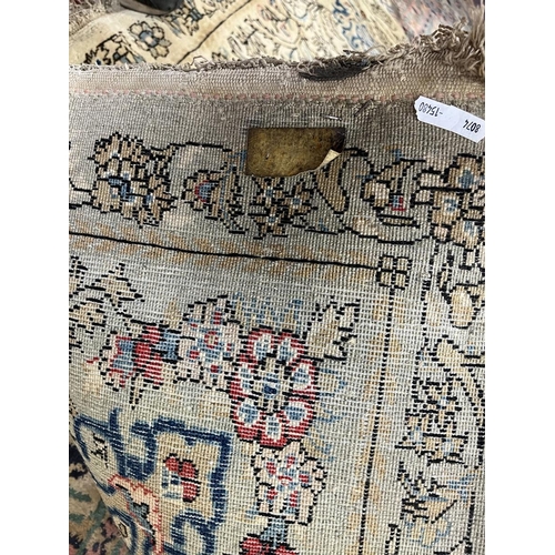 293 - Cream & blue patterned antique rug - Approx size: 275cm x 158cm