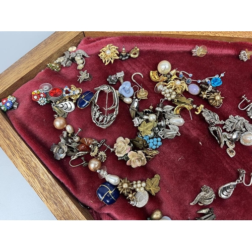 66 - Jewellery box and contents to include earrings, brooches and pendants etc