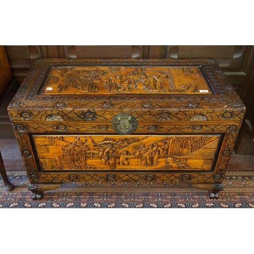 427 - Camphor wood carved chest with oriental scenes - Approx size: W: 102cm D: 52cm H: 60cm