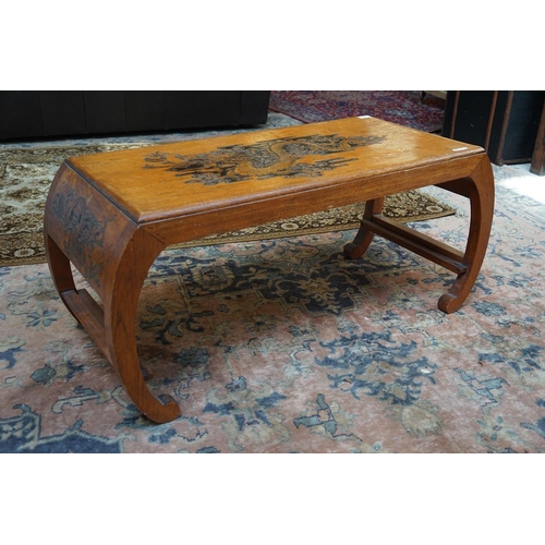 434 - Oriental coffee table carved with dragons to the top and sides