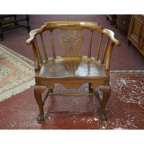 450 - Quality antique 'Story tellers' armchair with saddle seat of large proportions