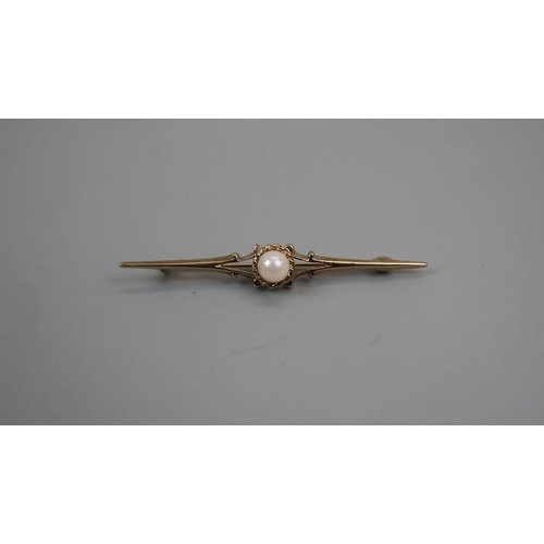 64 - 9ct gold pearl set bar brooch