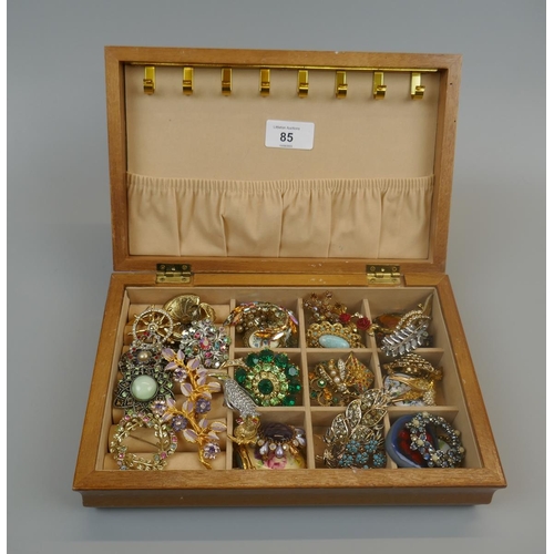 85 - Box of costume brooches