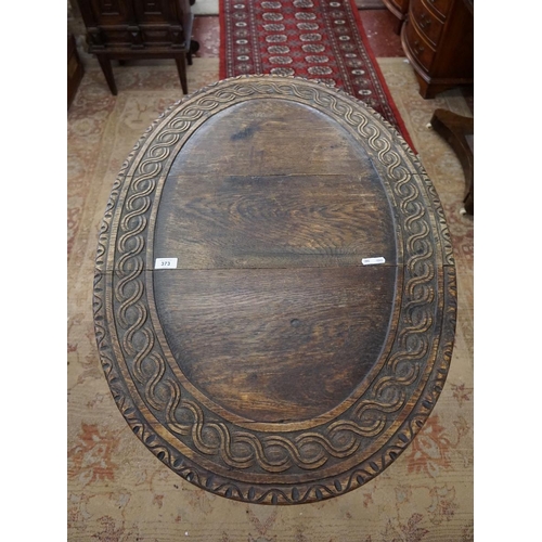 373 - Carved oak drop leaf table