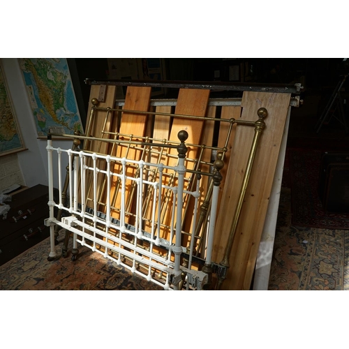 413 - 2 brass framed and painted framed Victorian beds with bases