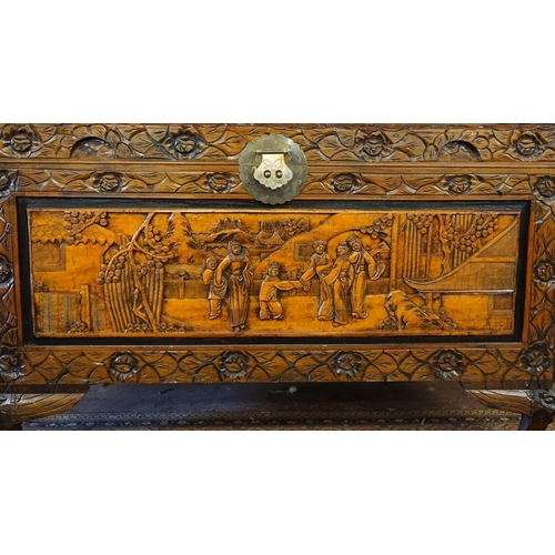 427 - Camphor wood carved chest with oriental scenes - Approx size: W: 102cm D: 52cm H: 60cm