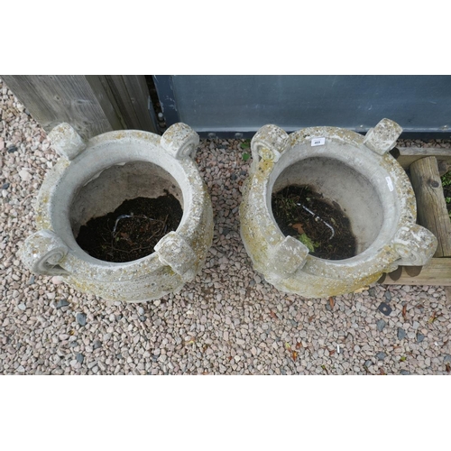 469 - Pair of large heavy stone planters adorned with cherubs - Approx height: 50cm