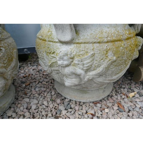 469 - Pair of large heavy stone planters adorned with cherubs - Approx height: 50cm