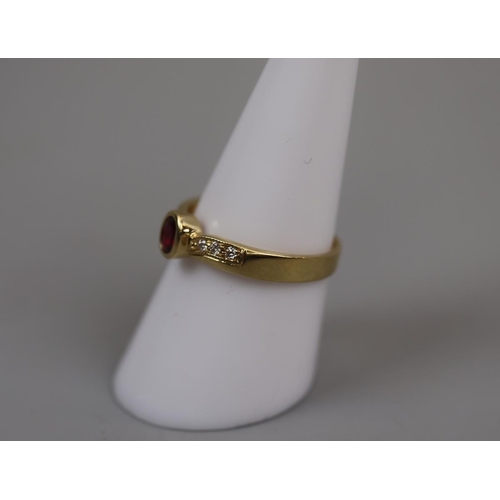58 - 18ct gold ruby & diamond set ring - Size: P